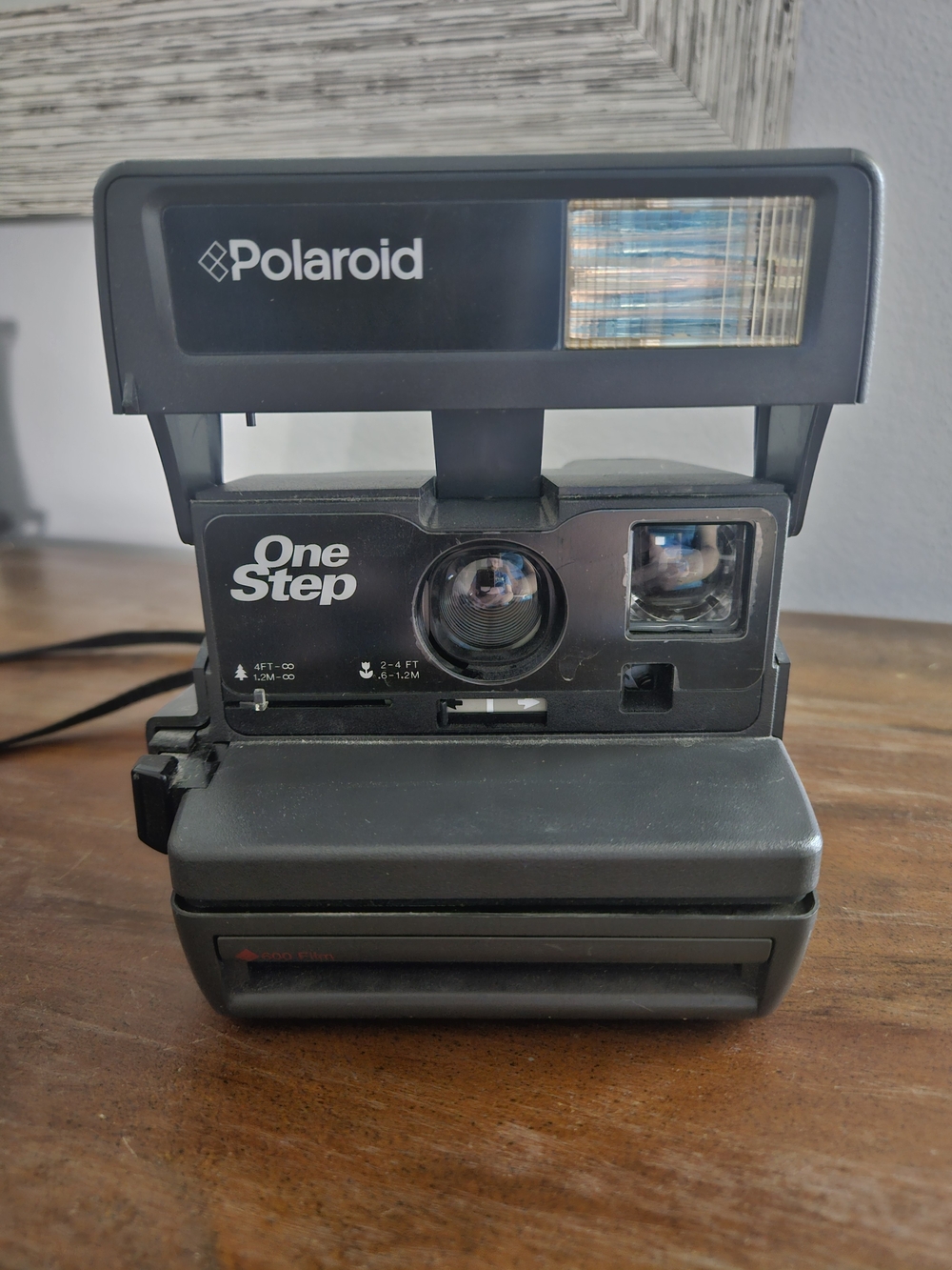 Vintage 80's-90's Polaroid 600 OneStep instant camera with a built-in flash